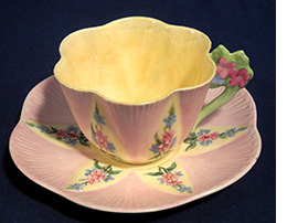 Pink and yellow floral Handled Dainty cup and saucer